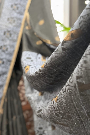 Black color body, Zari round buta, bluish color woven border and Pallu with gold Selvedge Soft Silk saree