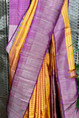 Mustard Kanchipuram saree with horizontal pattern beautifully complemented with stylist contemporary border.
