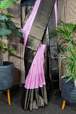 Pink Handwoven Kanchipuram silk saree with wide black non zari border with Viduthalai and Rudraksha motives.