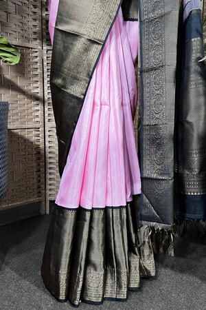 Pink Handwoven Kanchipuram silk saree with wide black non zari border with Viduthalai and Rudraksha motives.