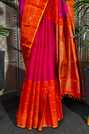 Magenta handwoven Kanchipuram Silk saree with wide orange checks border