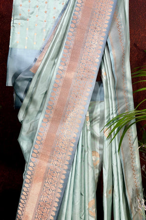 Handwoven Pastel Green Banarasi katan silk saree with kadua weave border