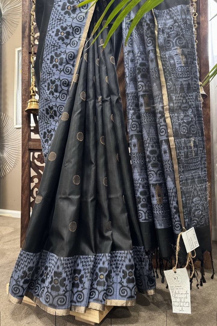 Black color body, Zari round buta, bluish color woven border and Pallu with gold Selvedge Soft Silk saree