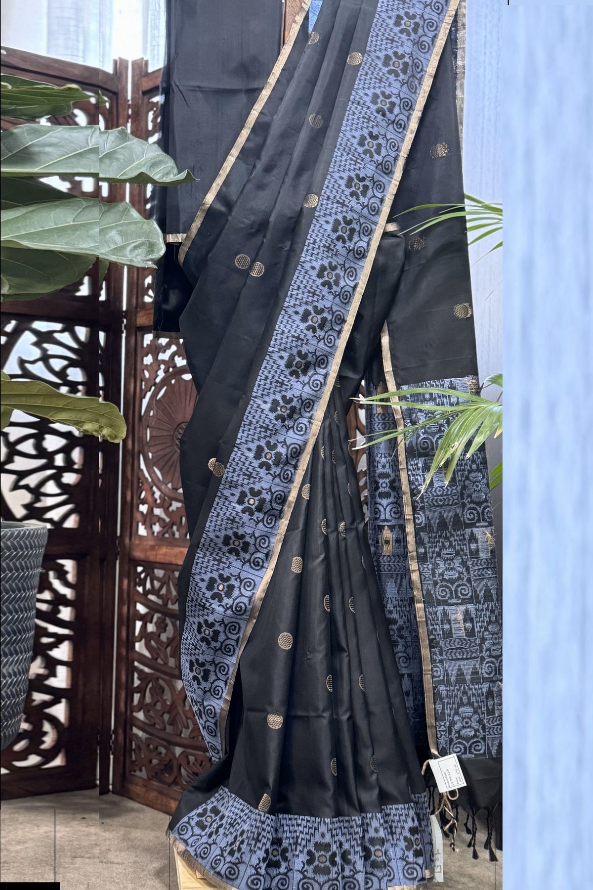 Black color body, Zari round buta, bluish color woven border and Pallu with gold Selvedge Soft Silk saree
