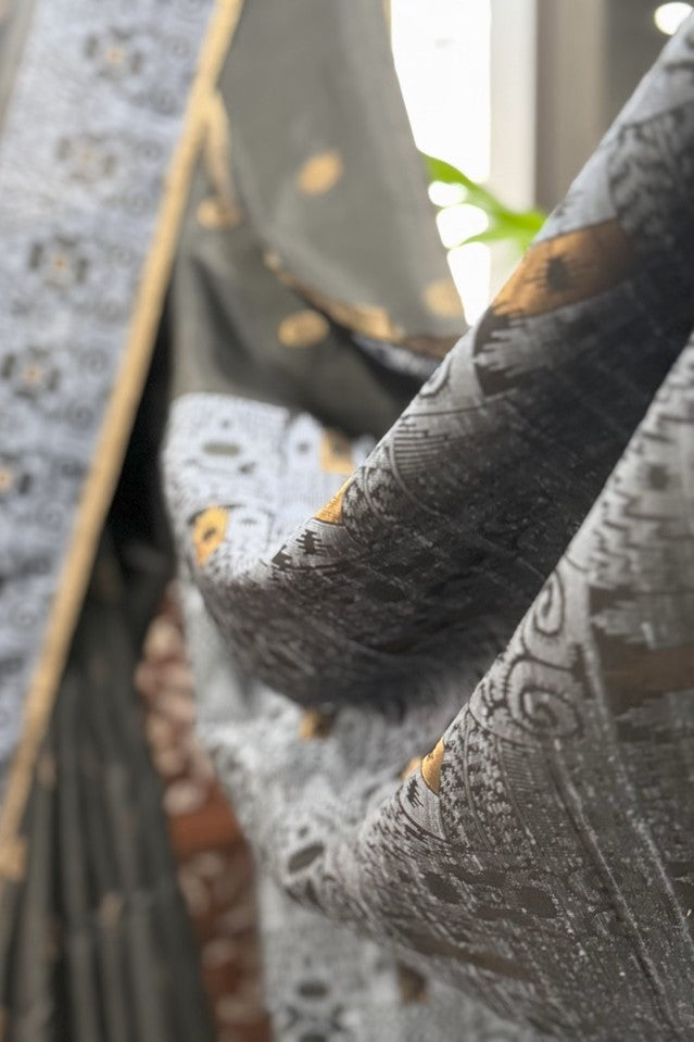 Black color body, Zari round buta, bluish color woven border and Pallu with gold Selvedge Soft Silk saree