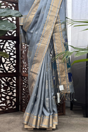 Grey color body with square silver Zari Butis, Cuddy border with sea Green and Blue pallu soft Silk saree