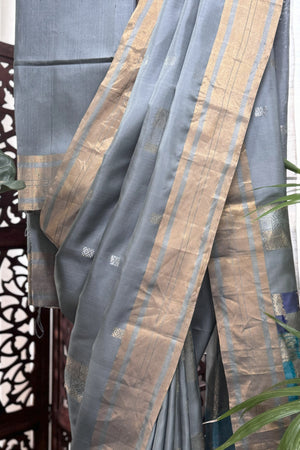 Grey color body with square silver Zari Butis, Cuddy border with sea Green and Blue pallu soft Silk saree