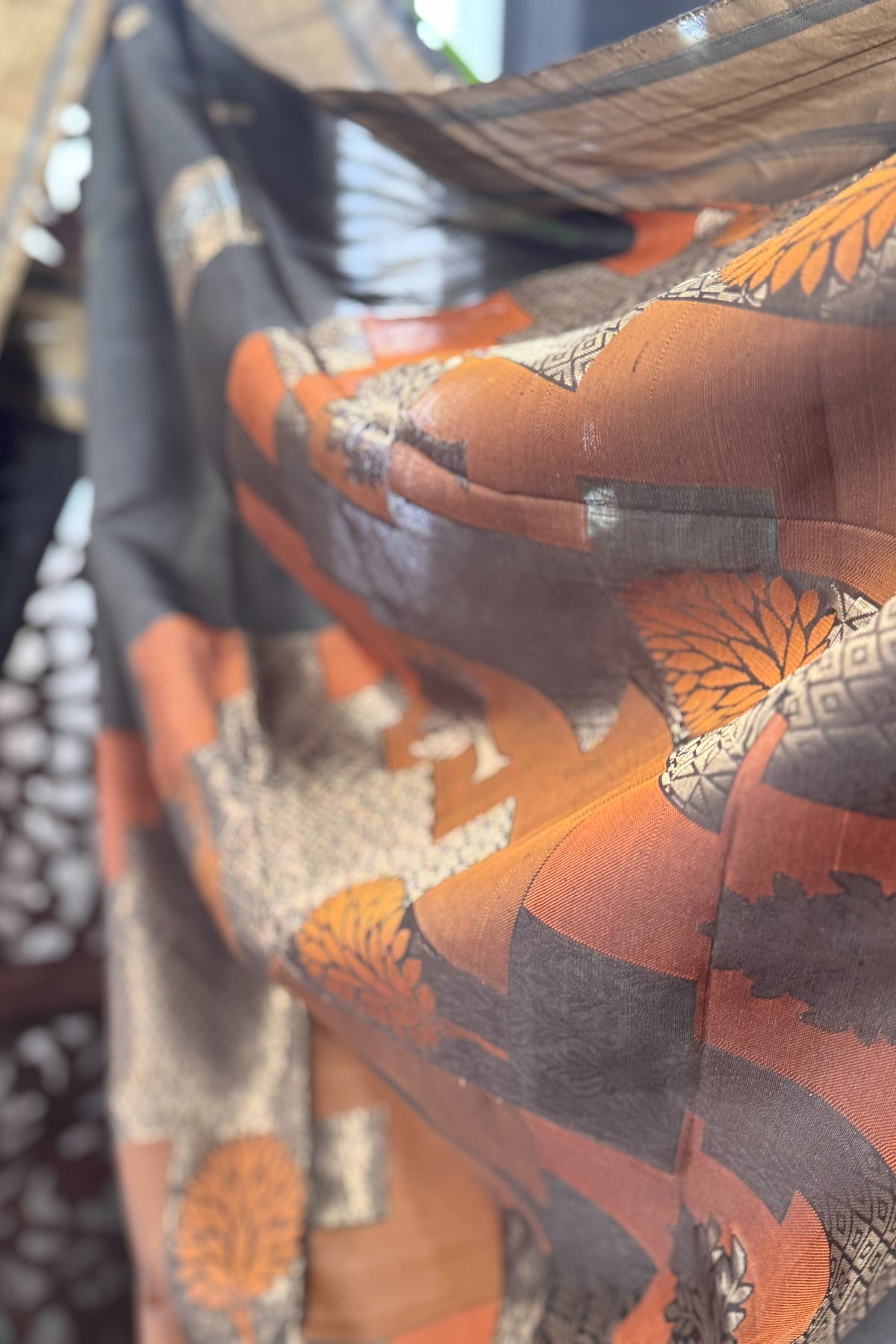 Blackish Green color body with square gold Zari Butis, Cuddy border with Burnt Orange pallu soft Silk saree