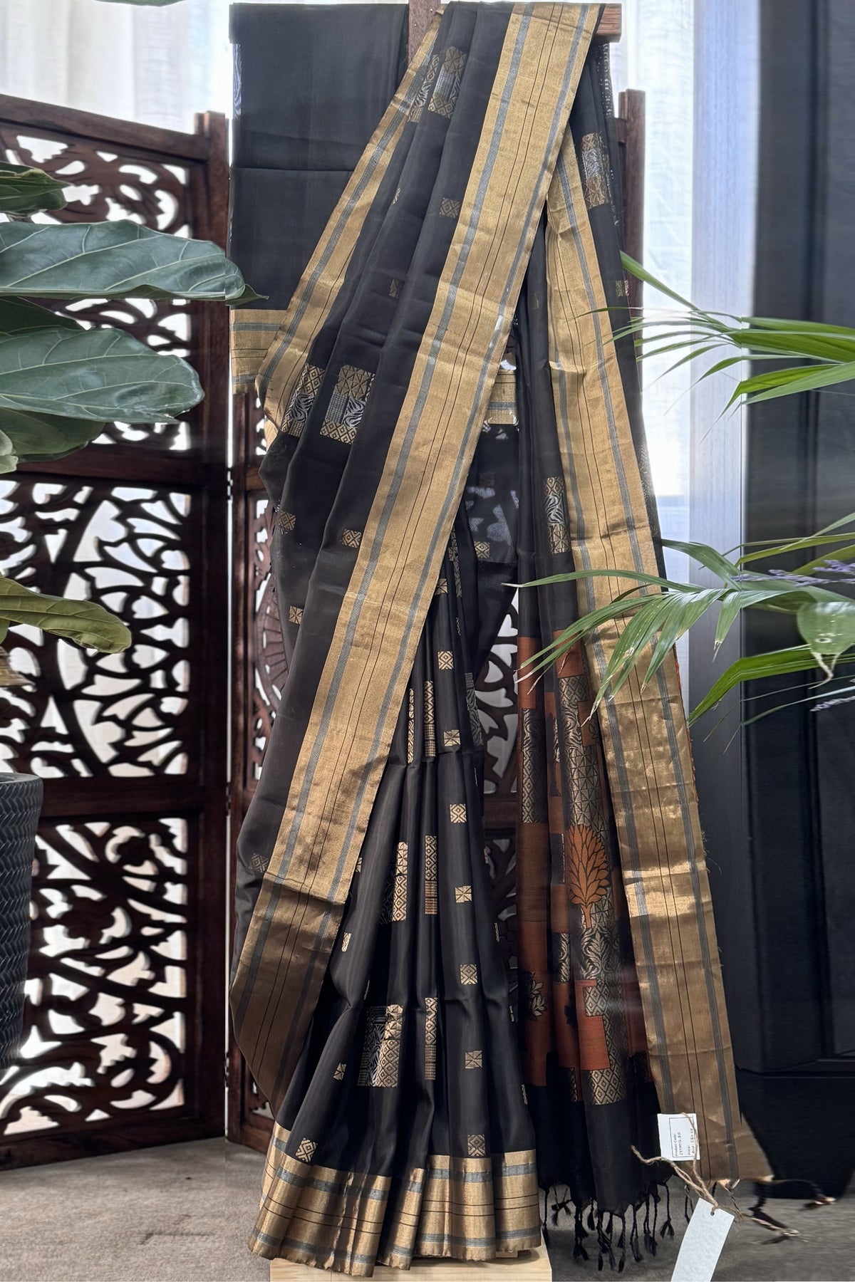 Blackish Green color body with square gold Zari Butis, Cuddy border with Burnt Orange pallu soft Silk saree