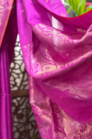 Deep Magenta color soft silk saree with beautiful burnt orange selvedge