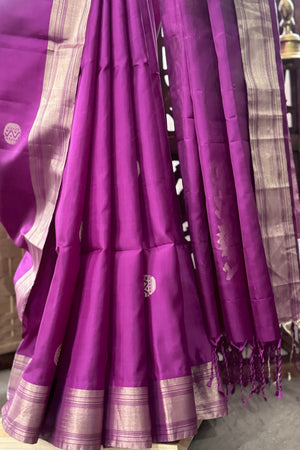 Purple color soft silk saree with zari butis all over body