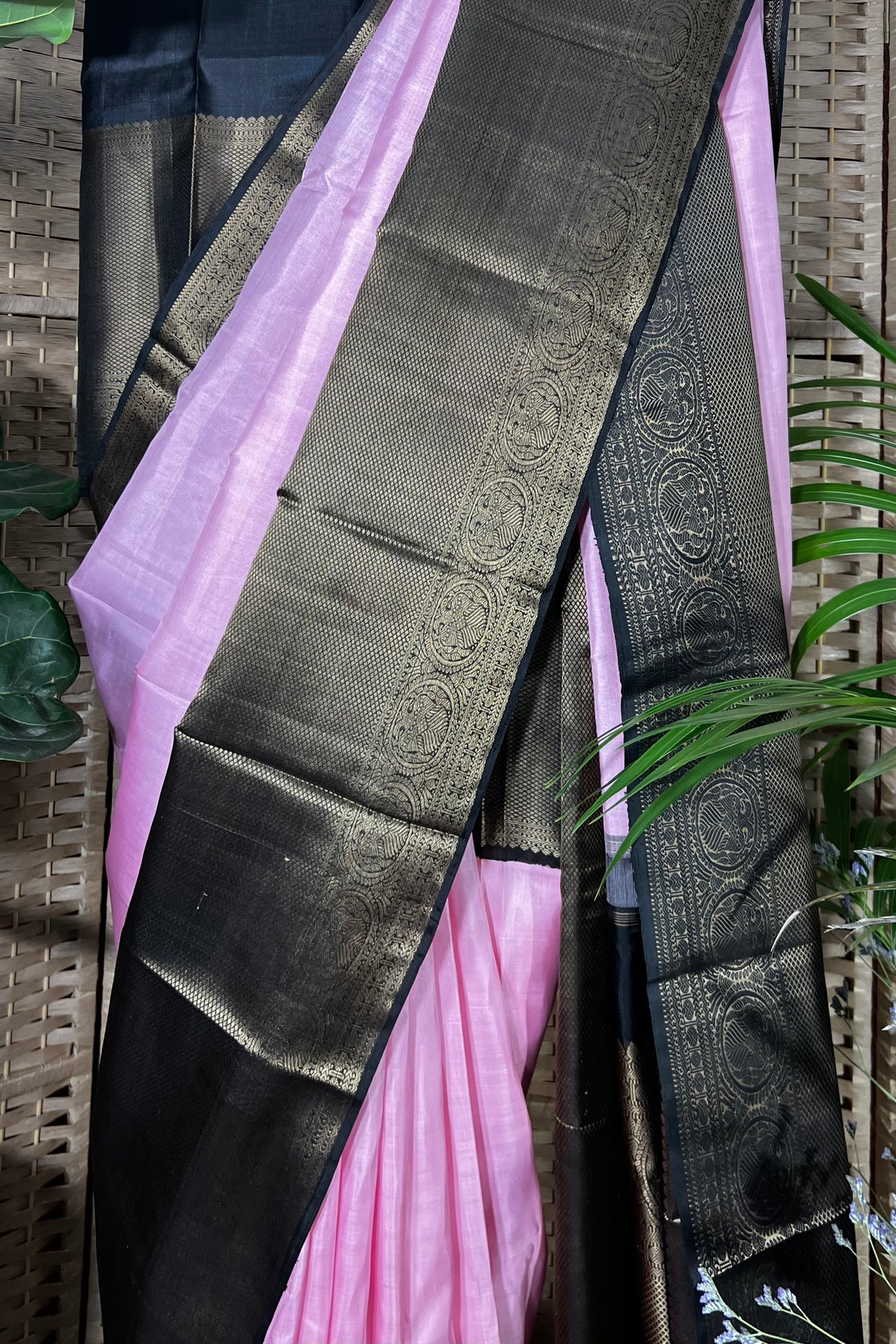 Pink Handwoven Kanchipuram silk saree with wide black non zari border with Viduthalai and Rudraksha motives.