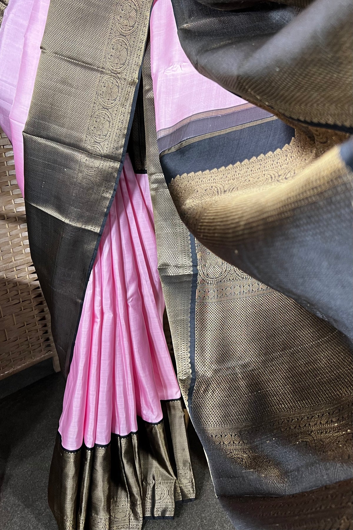 Pink Handwoven Kanchipuram silk saree with wide black non zari border with Viduthalai and Rudraksha motives.