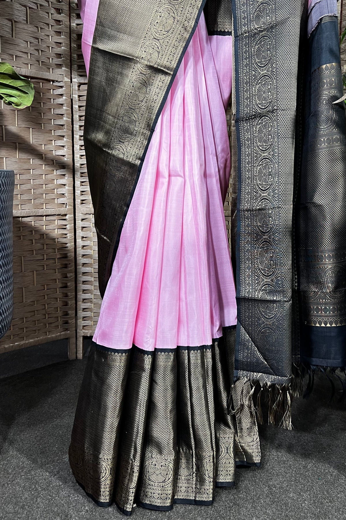 Pink Handwoven Kanchipuram silk saree with wide black non zari border with Viduthalai and Rudraksha motives.