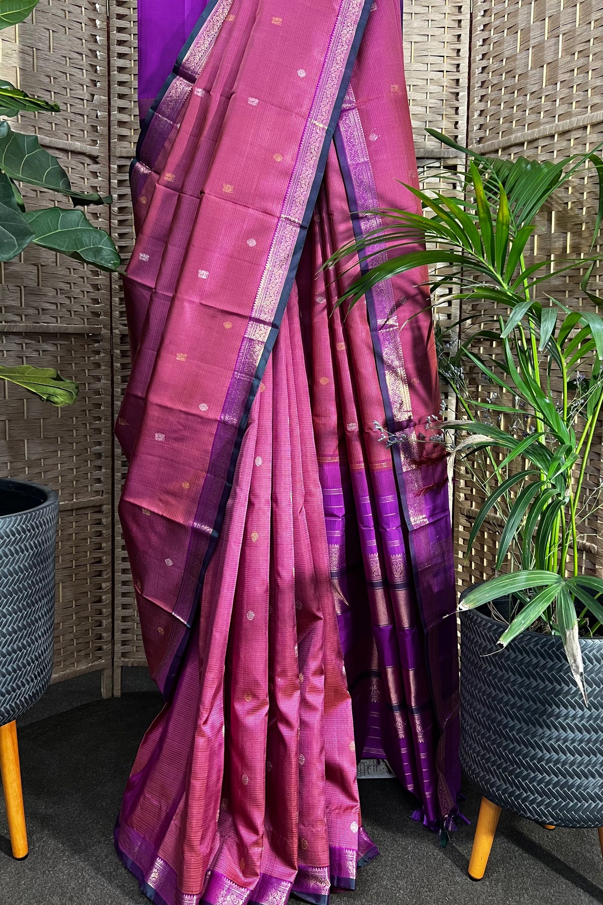 Pinkish purple Kanchipuram Silk saree with zari woven closely to give matt finish to the body with small Zari border