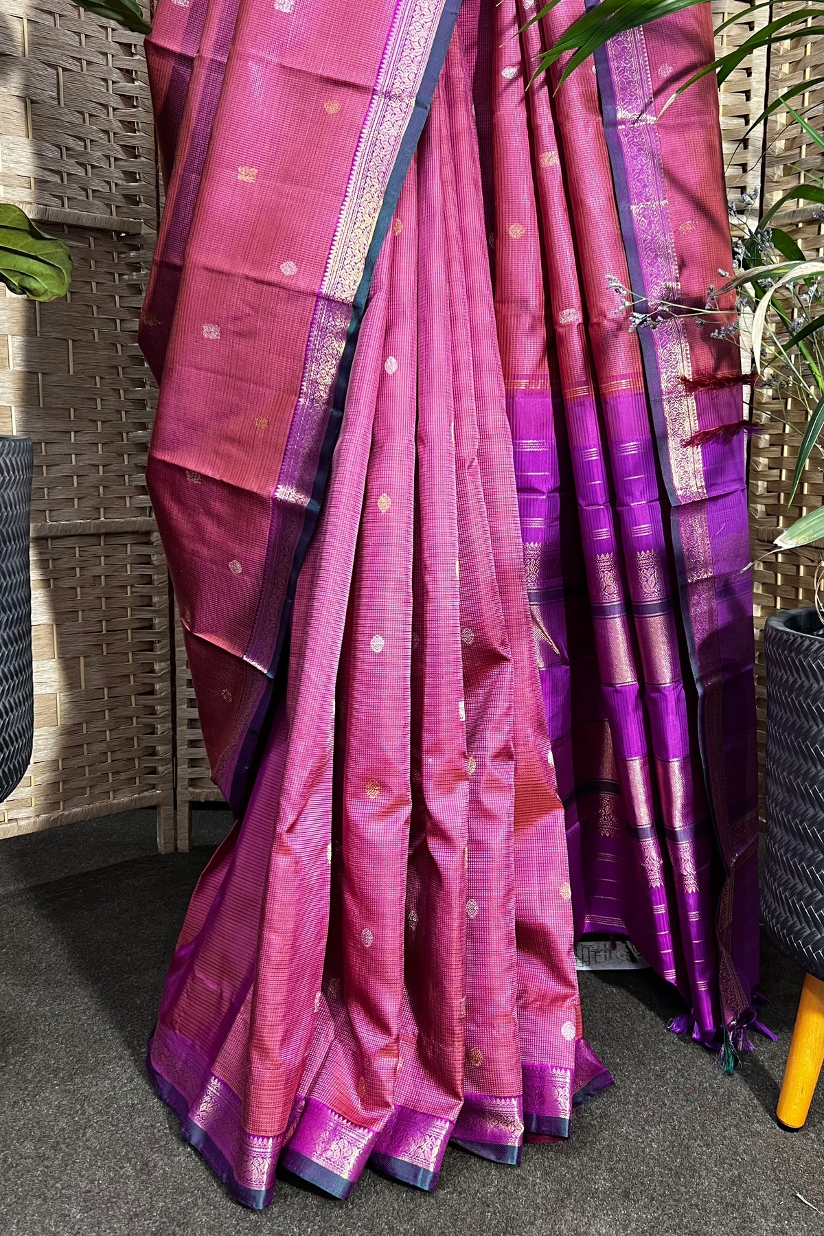Pinkish purple Kanchipuram Silk saree with zari woven closely to give matt finish to the body with small Zari border
