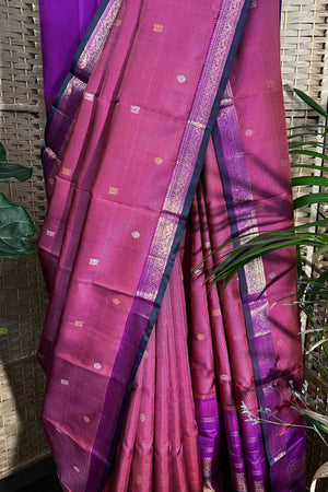 Pinkish purple Kanchipuram Silk saree with zari woven closely to give matt finish to the body with small Zari border