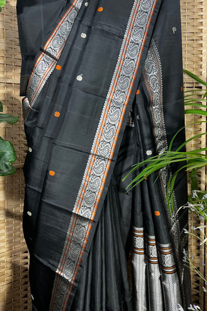 Black handwoven Kanchipuram Silk saree with burnt orange and silver mangaa motifs