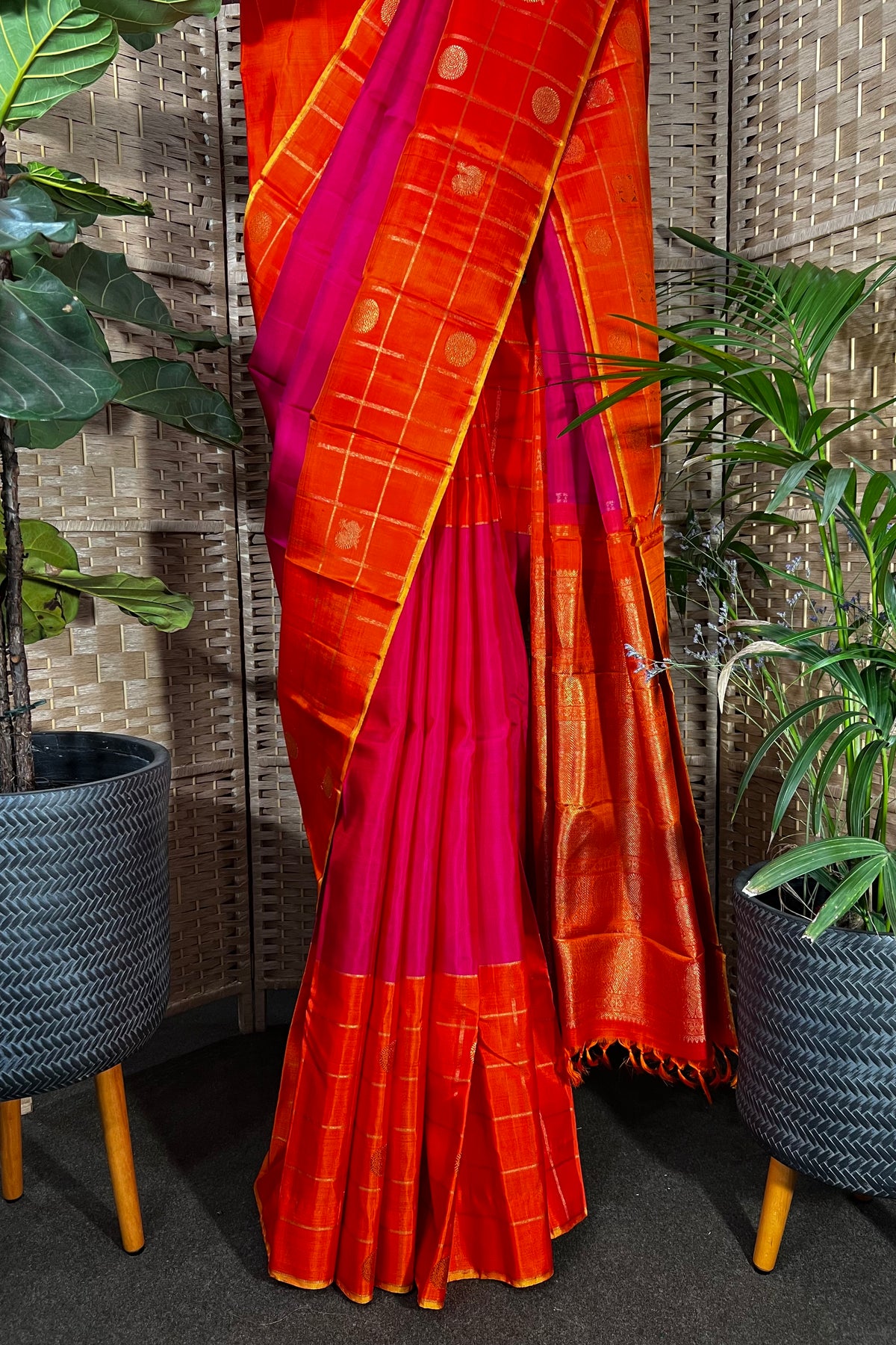 Magenta handwoven Kanchipuram Silk saree with wide orange checks border