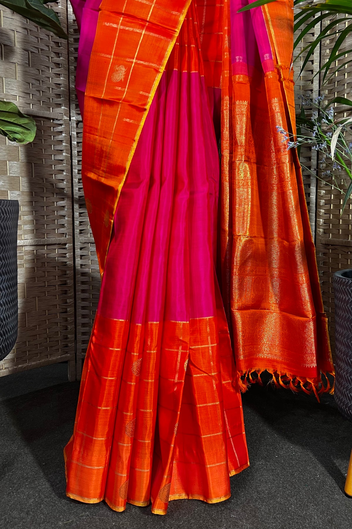 Magenta handwoven Kanchipuram Silk saree with wide orange checks border