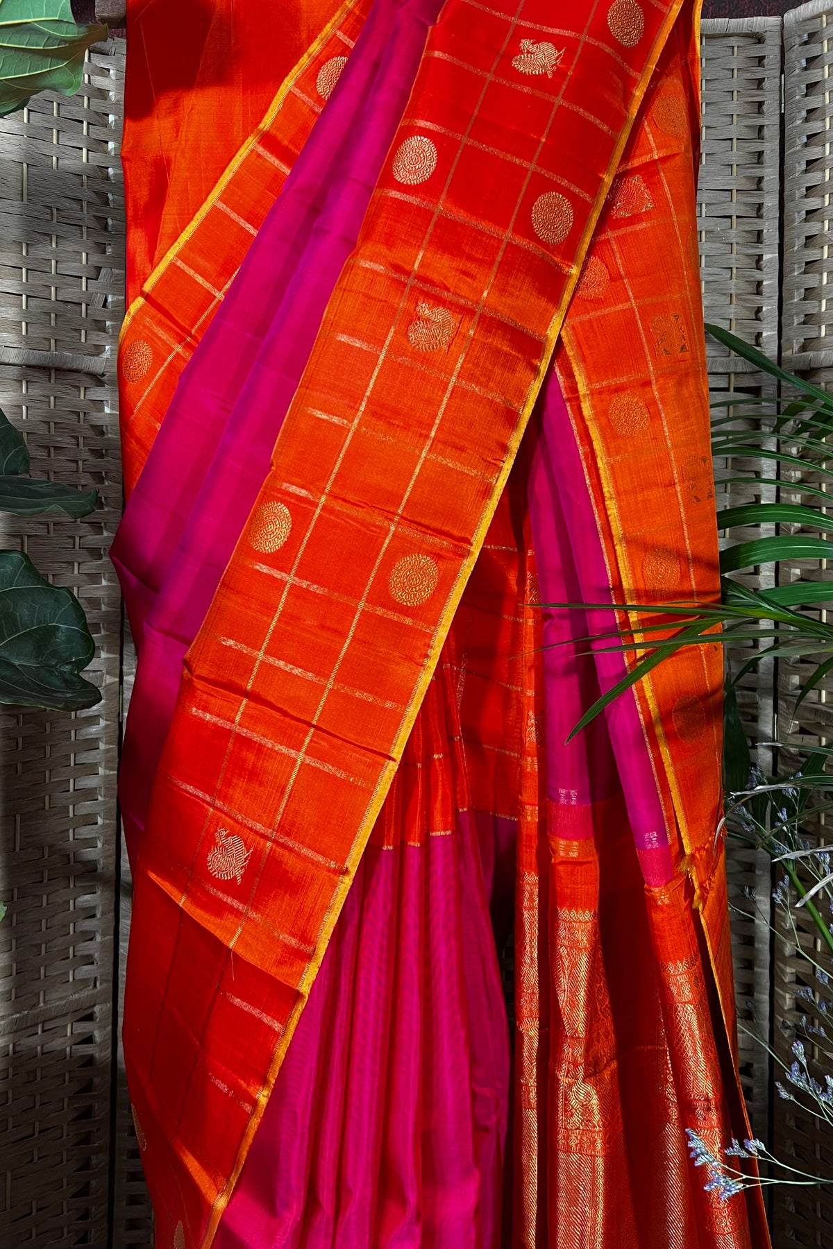 Magenta handwoven Kanchipuram Silk saree with wide orange checks border